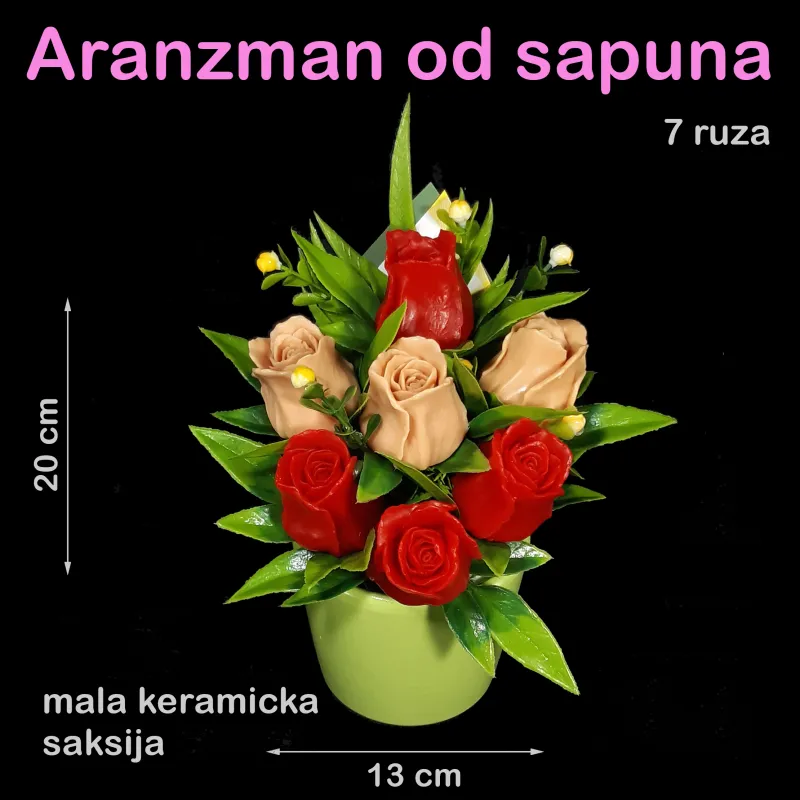 Crvene i krem ruže u maloj keramičkoj saksiji